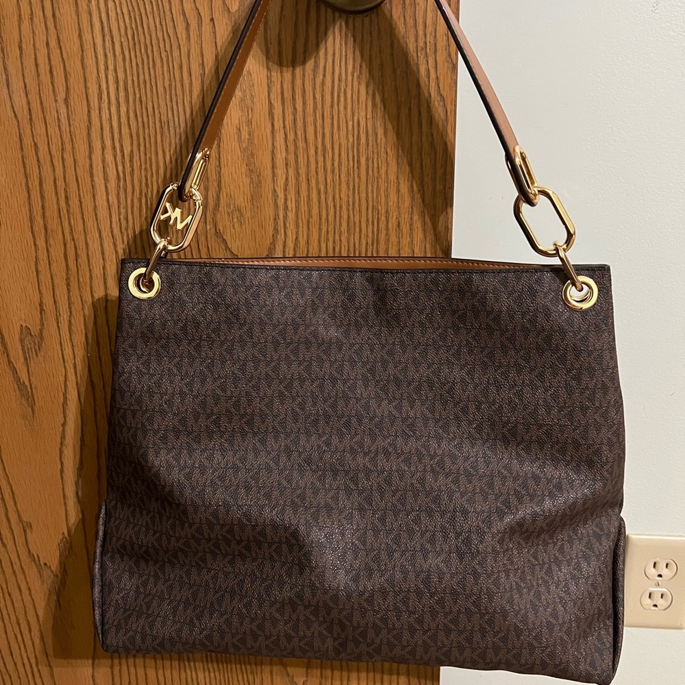 Like brand new Michael kors. Authentic paid over 300 for it. Wore it a few times
